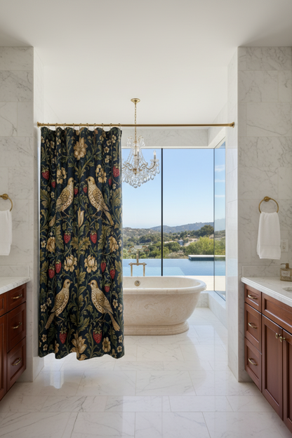 A shower curtain featuring a classic William Morris-style floral and bird pattern on a dark navy background, with gold, beige, and red details. The curtain is shown hanging from silver rings on a white rod, with a white bathtub edge visible at the bottom.